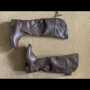 Brown knee high boots with zipper on the back